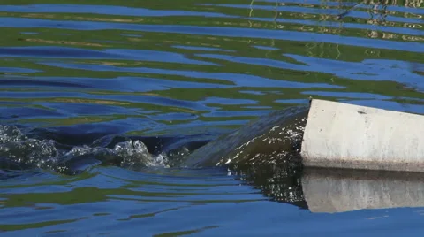 Outflow From Pipe Into Lake Stock-Footage 63243059