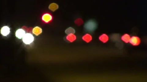 Outfocussed traffic lights at evening Video stock 42346387