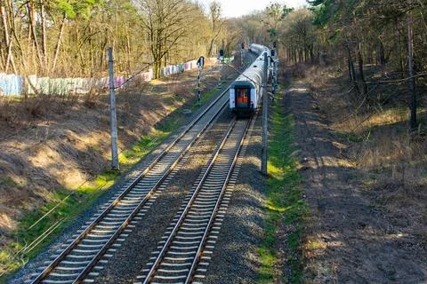 Outgoing train. View of the last car of the train Stock Photos