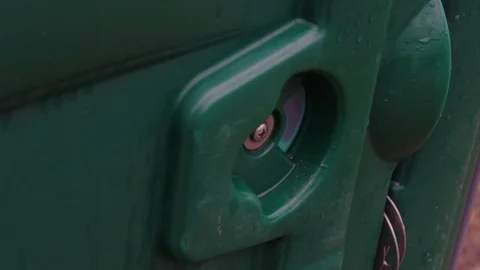 Outhouse door switch turns from open to locked Stock Footage 71690163