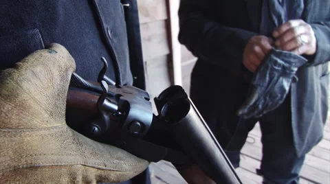Outlaw loading shotgun CU Stock Footage 47599618