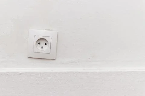 Outlet on the white wall Stock Photos