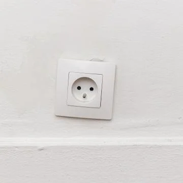 Outlet on the white wall Stock Photos