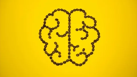 Outline of brain made of coffee beans. Stop motion Video stock 124492708