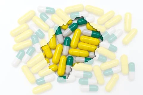 Outline map of lesotho with pills in the background for health and cure Stock Illustration