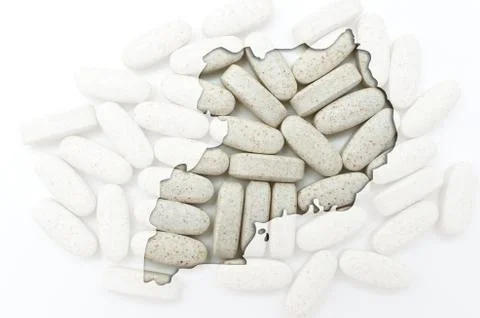 Outline map of uganda with pills in the background for health and cure Stock Illustration