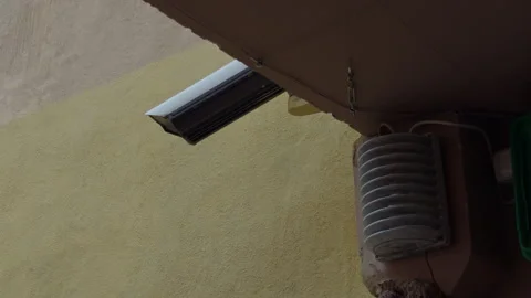 Outline of pipe against textured wall. Shadowed pipe outline contrasted with Stock Footage 333909061