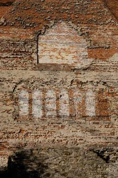Outlines of old windows on exposed brick exterior. Stock Photos