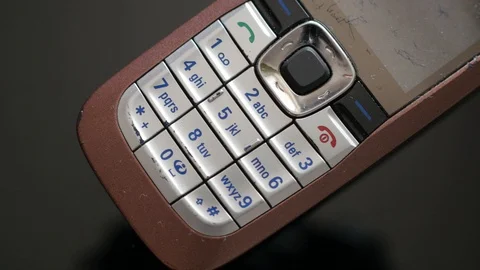 Outmoded, old school model of  mobile phone Stock Footage 87184539