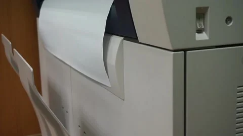 The output of printed sheets from the printer. printing documents in the office Stock Footage 143273794