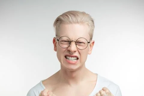 Outraged man gestures angrily, being irritated, outraged Stock Photos