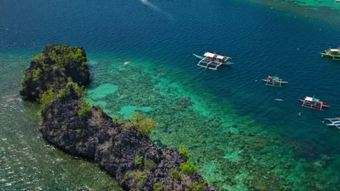 Outrigger Boat on Coral Reef Flat Tilt Down Stock Footage 335919988