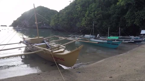 Outrigger Boats on Empty Sandy Beach, Sipalay, Negros island, Philippines Stock Footage 336617003
