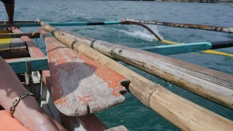 Outrigger Canoe Turquoise Waves with Stabilizer Cutting Through Water Stock Footage 219842195