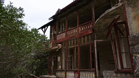 Outside of an abandoned and destroyed villa Stock Footage 267343402