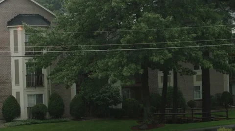 Outside condo complex in the rain Stock Footage 40844352