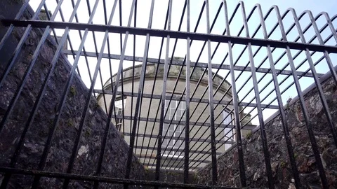 Outside an Imposing Prison, Unwelcoming Bars of Penitentiary, in 4K Stock Footage