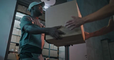 Outside of Logistics Distribution Warehouse at Night: Worker Giving Cardboard Vídeo Stock 313343039