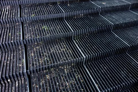 Outside metal stairs framework. Steps from iron straps and gaps. Industrial s Stock-Fotos