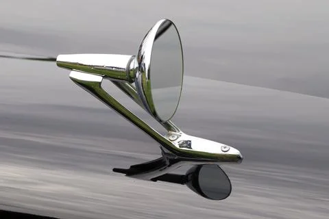 Outside mirror of a black old timer Stock Photos