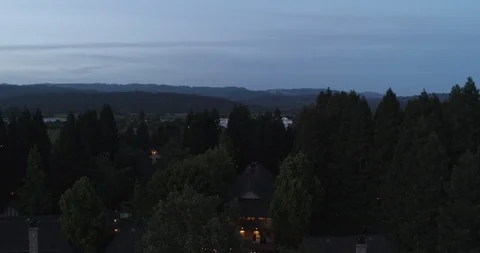 Outside party event by fields at evening dusk. Drone aerial C Stock Footage 111650362