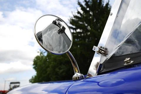 Outside rear mirror of an old timer car 스톡 사진