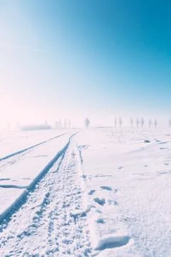 Outside snow path, blue sky, sunshine and snow everywhere. Winter landscape o Stock Photos