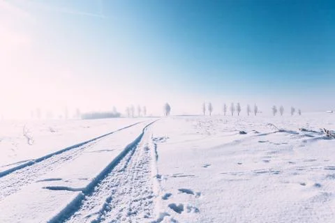 Outside snow path, blue sky, sunshine and snow everywhere. Winter landscape o Stock Photos