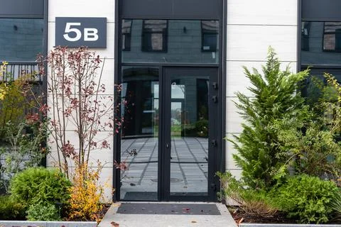 Outside solid glass door with building exterior Fotos de archivo
