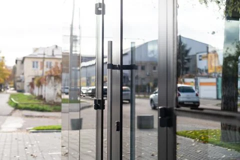 Outside solid glass door with building exterior Fotos de archivo