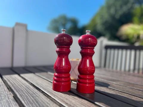 A outside table in a cafe or restaurant with a salt and pepper Foto stock