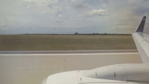 Outside View from an airline jet window during takeoff Stock Footage 76533759