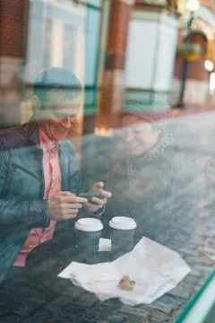 Outside view of a couple in a cafe Stock Photos