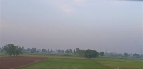 Outside view of fields from inside of running train Stock Footage 340193226
