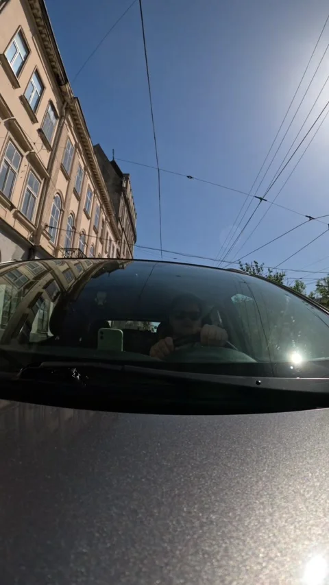 Outside view of man driving car by city Stock-Footage 276348206