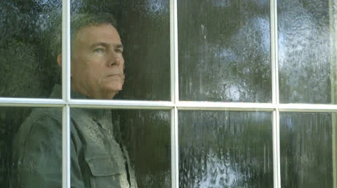 Photo of a Man Looking Outside of His Window · Free Stock Photo