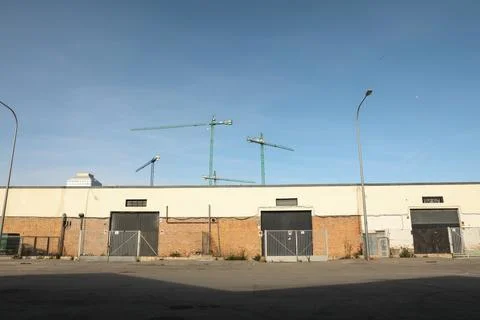 Outside view of a small, empty warehouse in an industrial area. Horizontal. Fotos Stock
