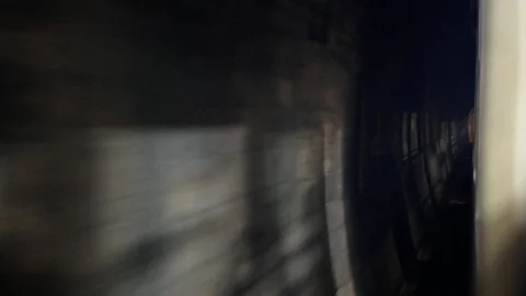 Outside view of a train traveling through a tunnel Stock Footage 103492495