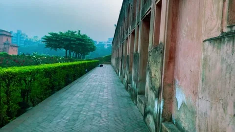 Outside wall of the Lalbagh fort, wall with walking way, building with nature Stock Footage 295401008
