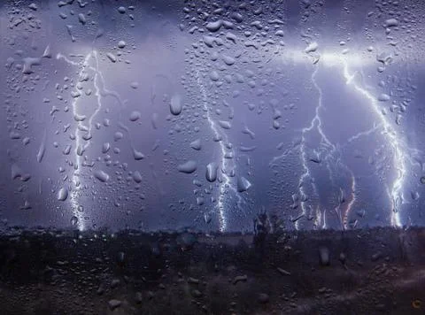Outside the window, lightning, rain and wind, view from the window Stock Photos