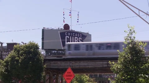 Outside of wrigley field elevated train game day Stock Footage 84523329