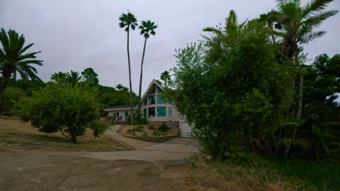 Outskirts of a small island settlement with tiny houses and greenery Video stock 278832111