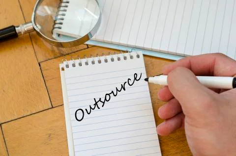 Outsource concept on notebook Stock Photos