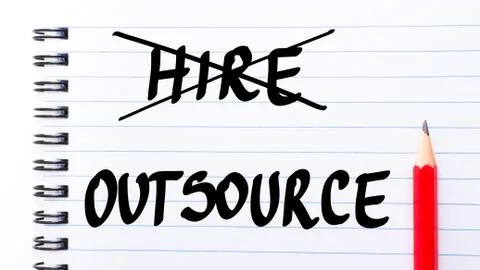 Outsource instead of Hire written on notebook page Stock Photos