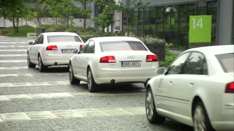 Outstanding Audi A8 L, white limousines approaching business center Video stock 49760357
