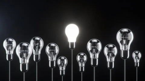 Outstanding Glowing Light bulb floating on black color background. Stock Footage 280542312