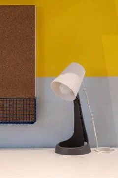 Outstanding table lamp on the table with the yellow background. Image contain Stock Photos