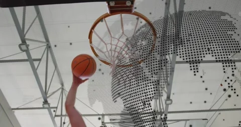 Outstretched arm entering frame and dunking ball through hoop under sports Stock-Footage 318115016