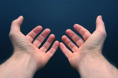 Outstretched arms with open palms Stock Photos