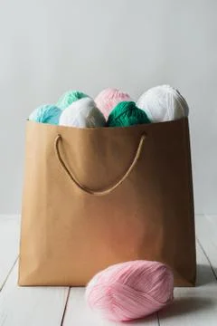 Oval acrylic wool yarn thread skeins with kraft package Stock Photos